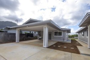 Finished home exterior with covered carport and entryway from an Atlas Construction renovation in Honolulu